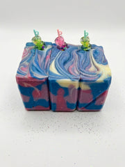 Three blackberry sippy soap bars side by side showing the blue, pink and cream swirl through the bar