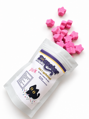 Zoapster Pink Bath Sprinkles pouch with pink sprinkles arranged beside it.