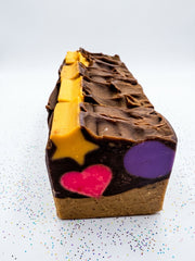 A full-size Biggi chocolate cone soap bar from the side, piped chocolate top and yellow star