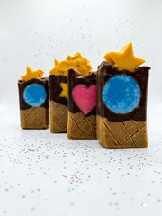 A group of handmade chocolate cone soap bars in cream and brown layers