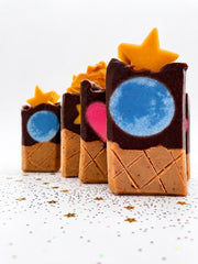 Three Mini chocolate cone soap bars sized for a child's hand, with waffle-textured bases
