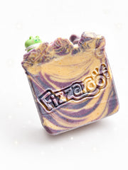 A single honey and lavender swirled soap bar with a piped top and a small topper
